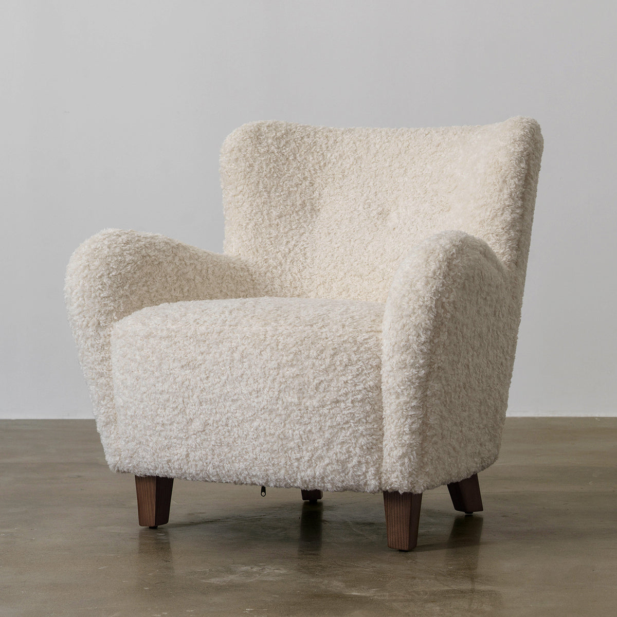 Nuantuo cream textured fabric wingback chair, three-quarter front view