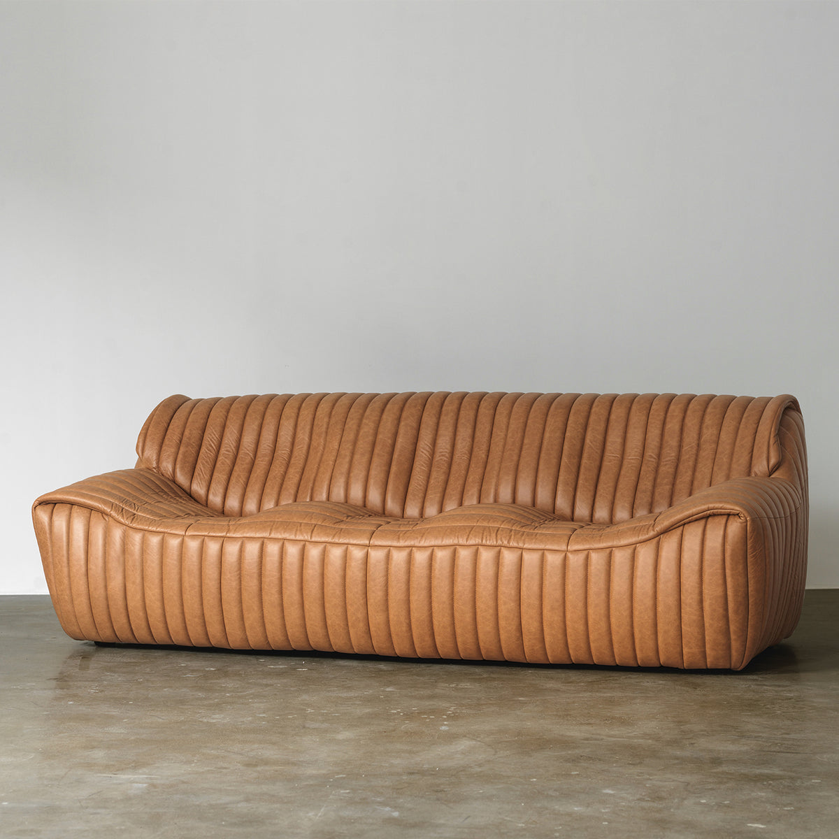Sculptural Channel-Tufted Sofa — Caramel Brown