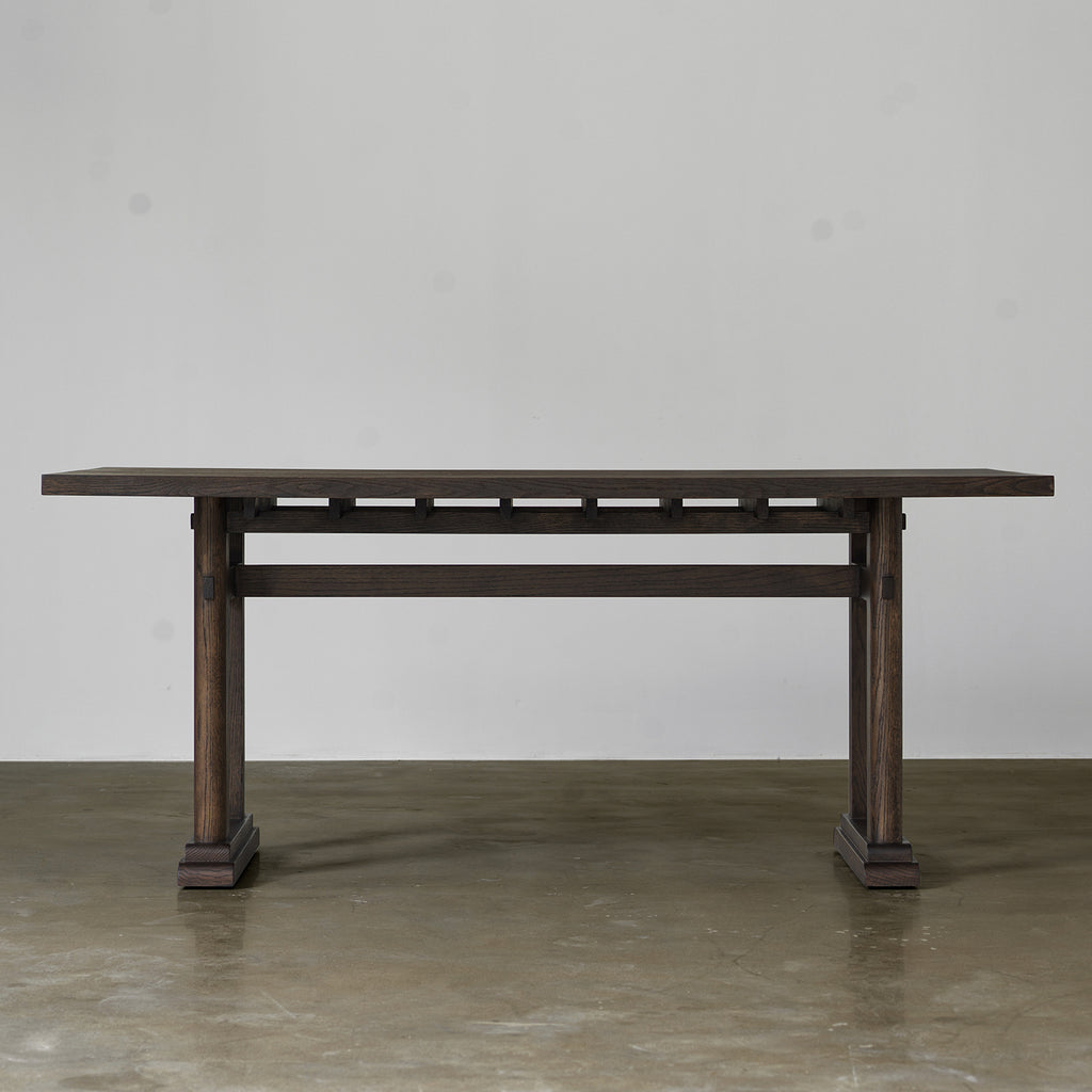 Distressed wood dining table in vintage finish front view

