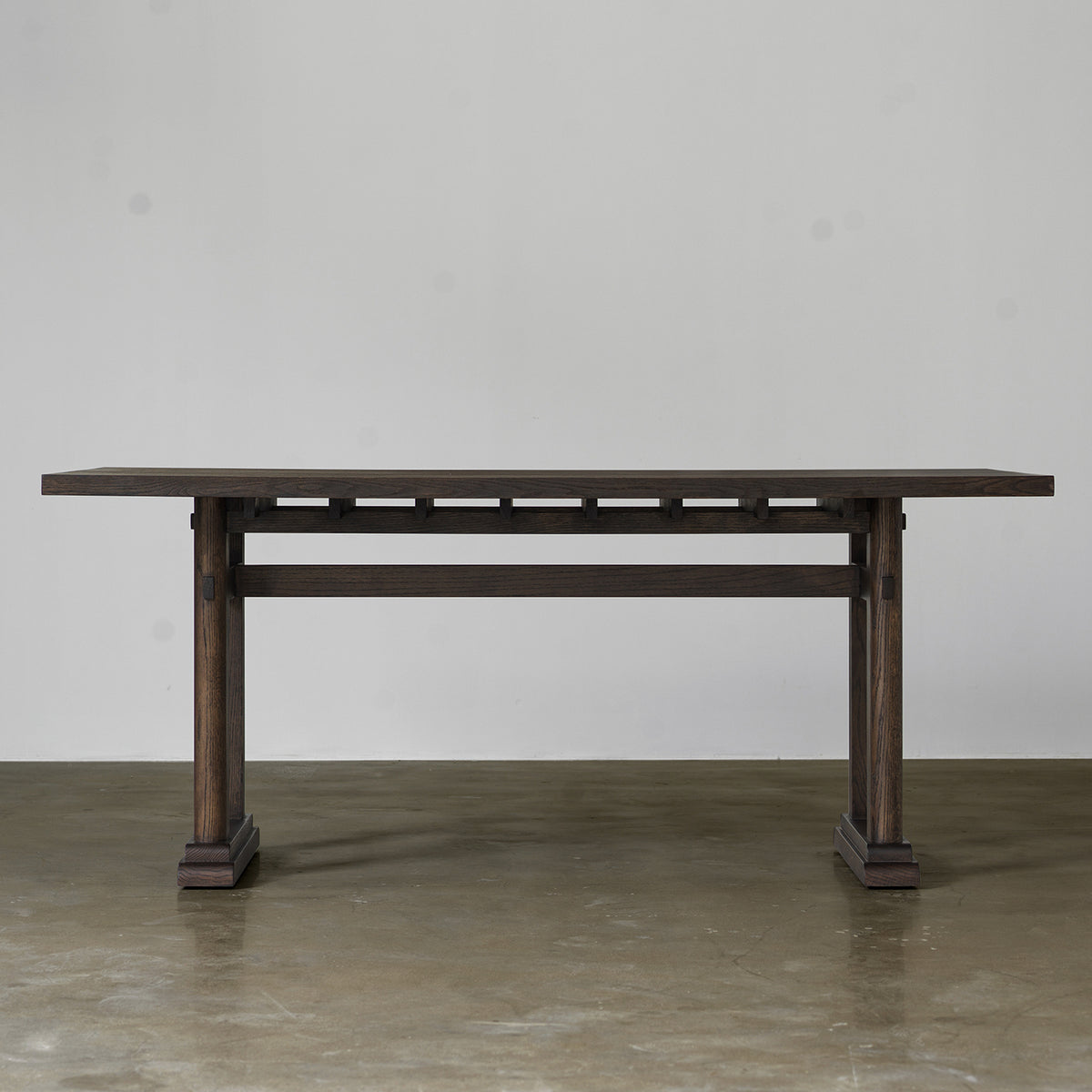 Distressed wood dining table in vintage finish front view
