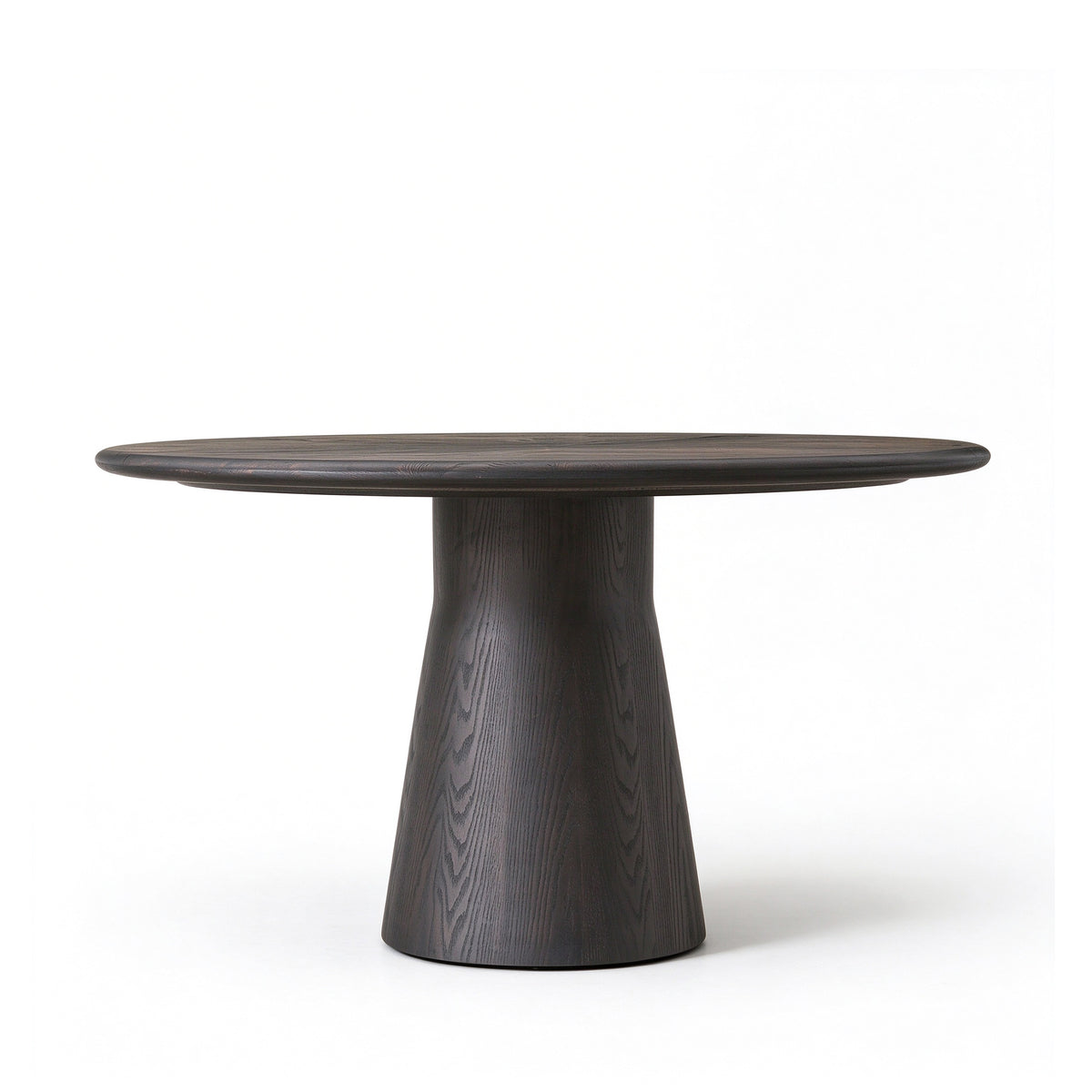 Front view of vintage distressed round solid wood dining table with central pedestal base on white background