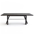  Front view of solid red oak dining table featuring architectural trestle legs and metal tie rod