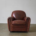 Vintage brown club chair three-quarter view