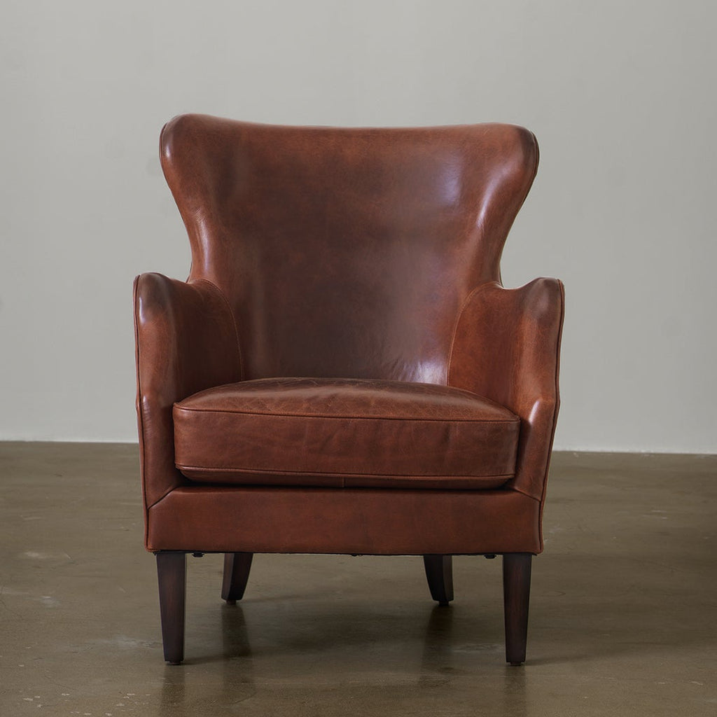 Vintage cowhide leather wingback chair front view