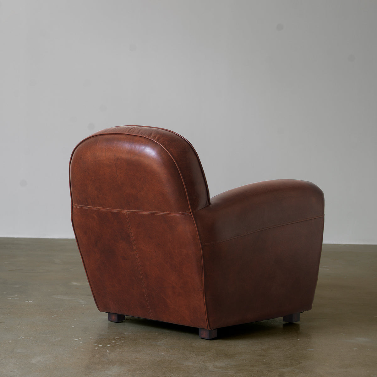 Vintage upholstered club chair side and back view
