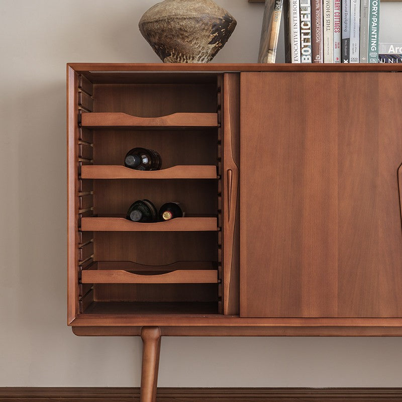 Curved wooden wine racks inside a boxwood sideboard storage compartment
