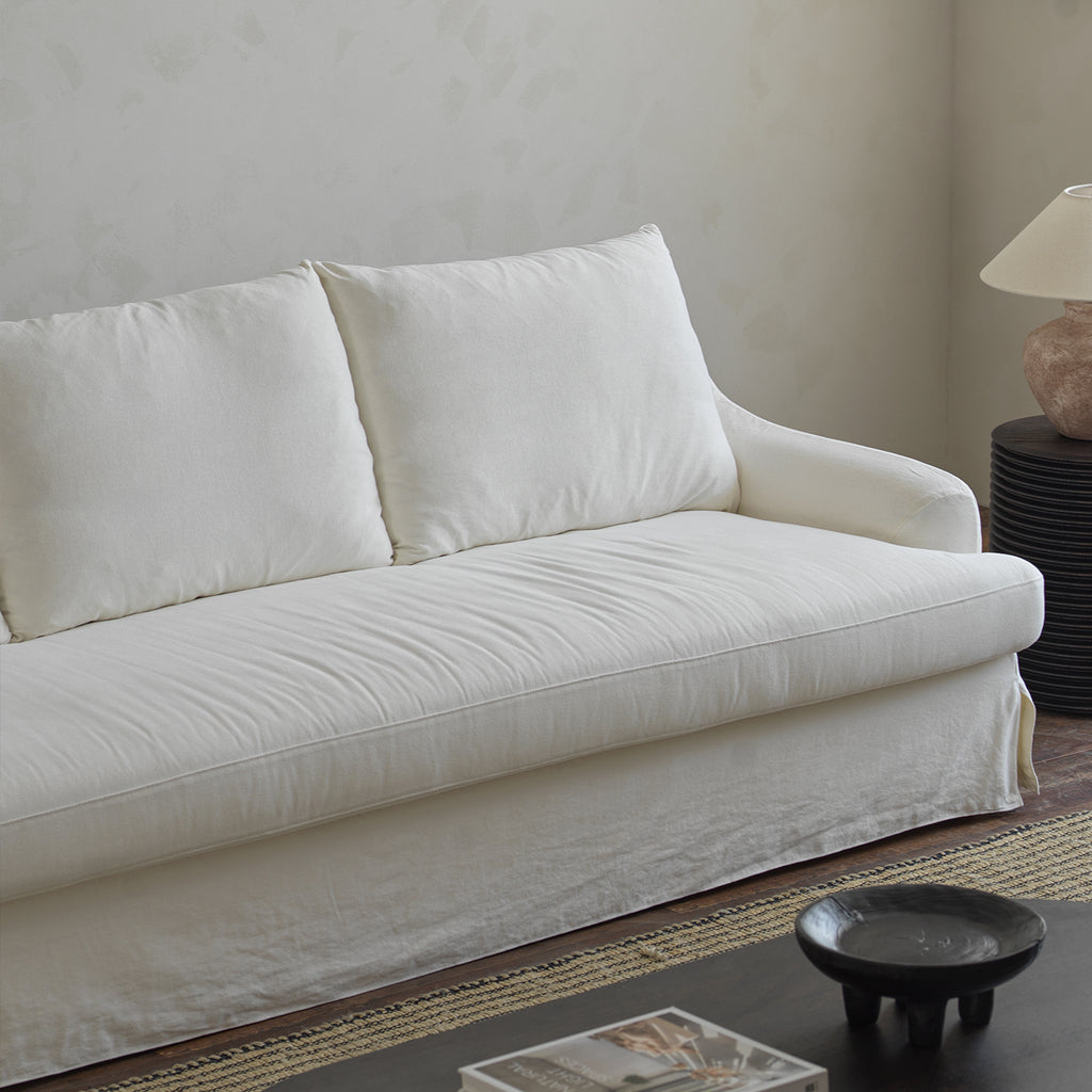 1057 Relaxed Skirted Sofa with Sloping Arms — Ivory