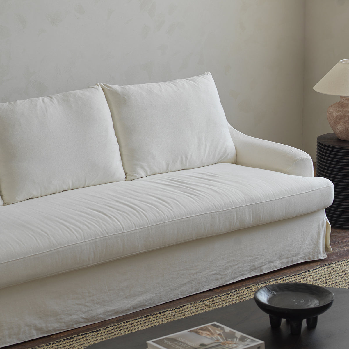 1057 Relaxed Skirted Sofa with Sloping Arms — Ivory