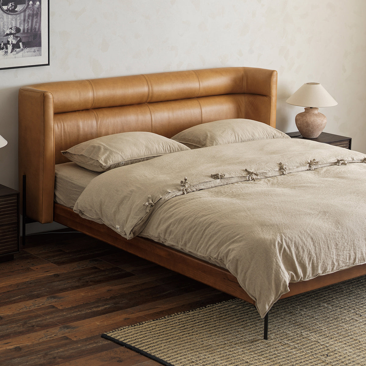 Caramel brown leather headboard and red oak bed frame