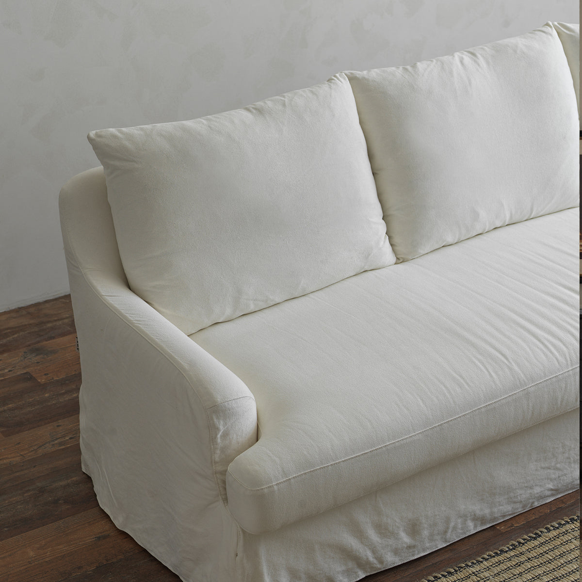 1057 Relaxed Skirted Sofa with Sloping Arms — Ivory