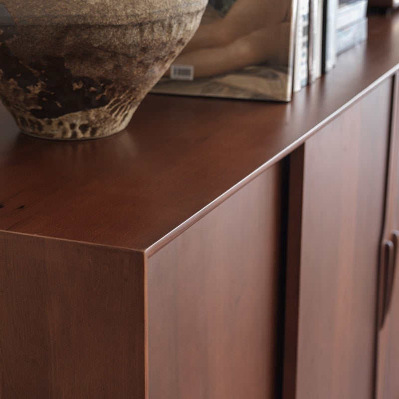 Boxwood sideboard corner detail showing the smooth top surface and panel edge