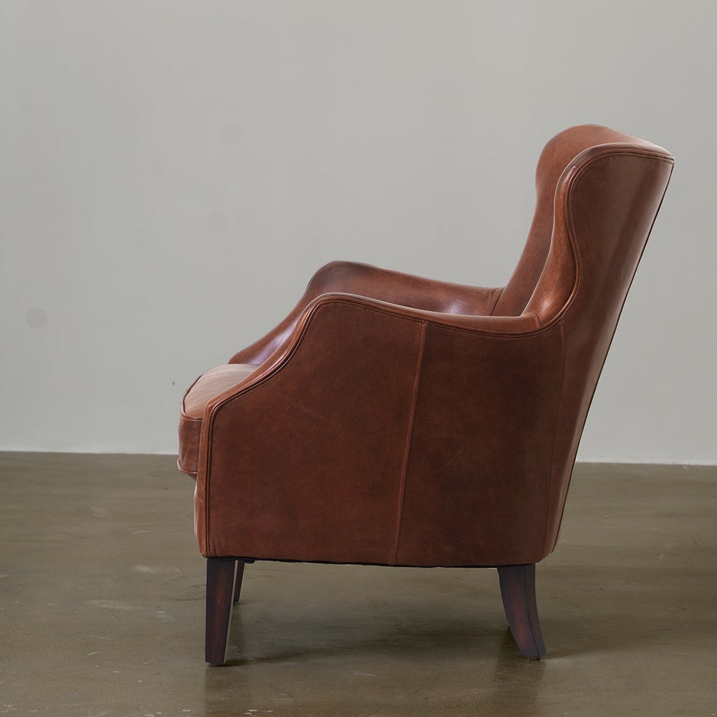 Vintage leather wingback chair side view