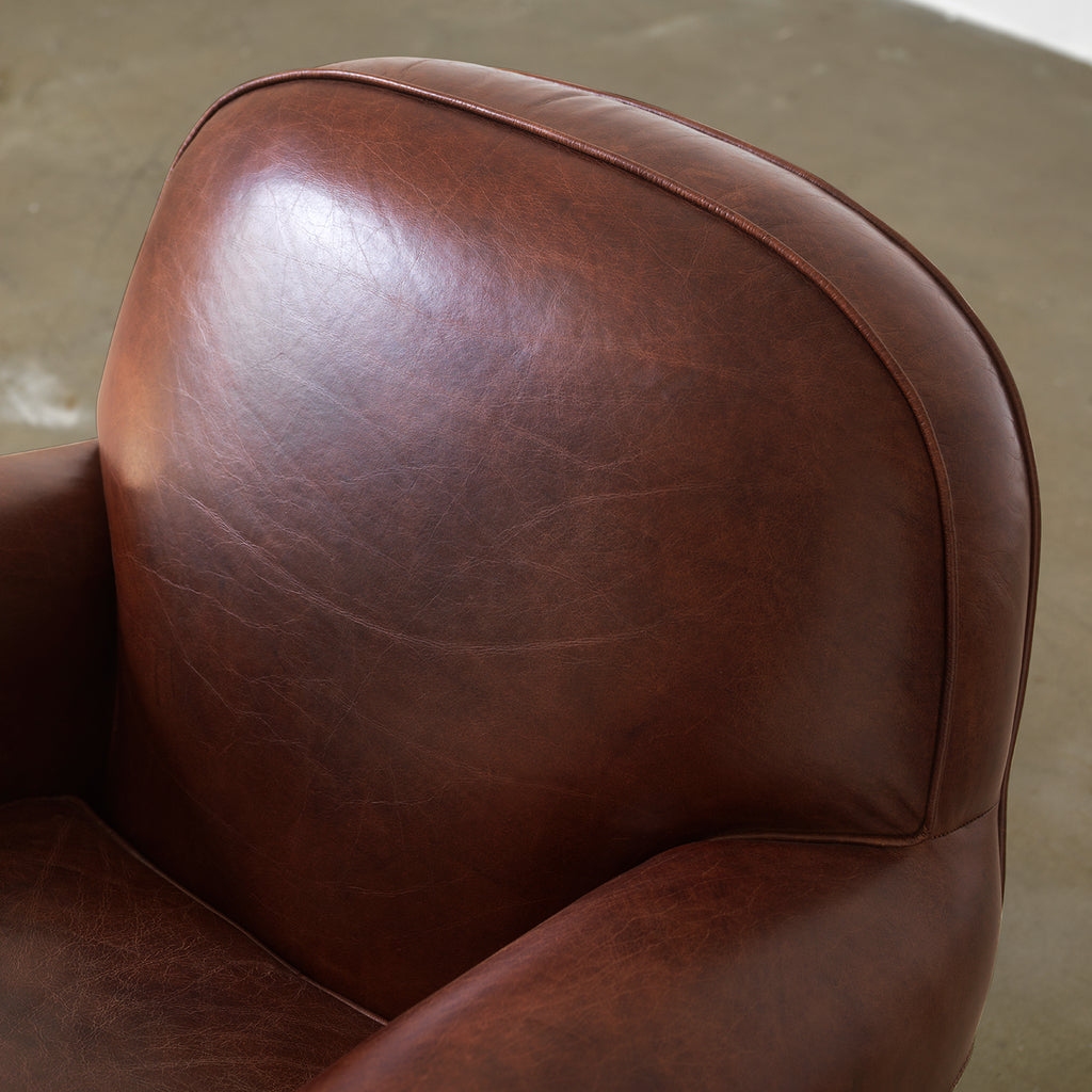 Vintage brown club chair rounded back detail