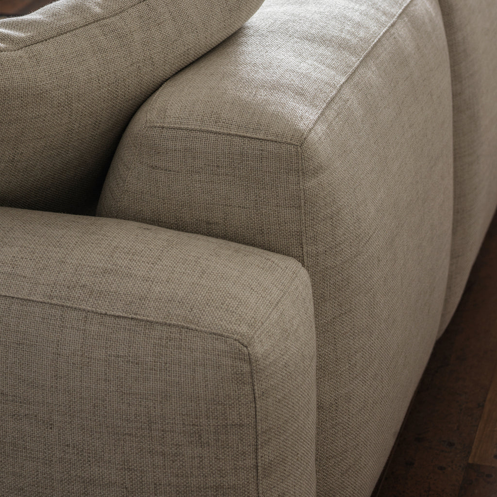 Cream cotton-linen upholstery and cushion detail