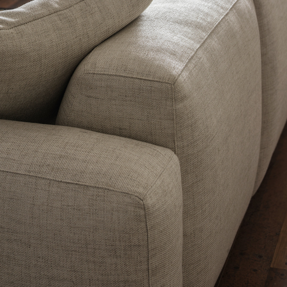 Cream cotton-linen upholstery and cushion detail