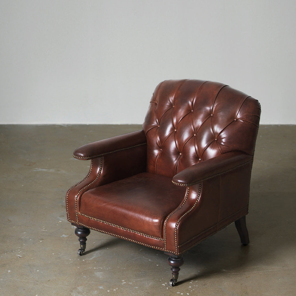 Brown cowhide leather club chair three-quarter view