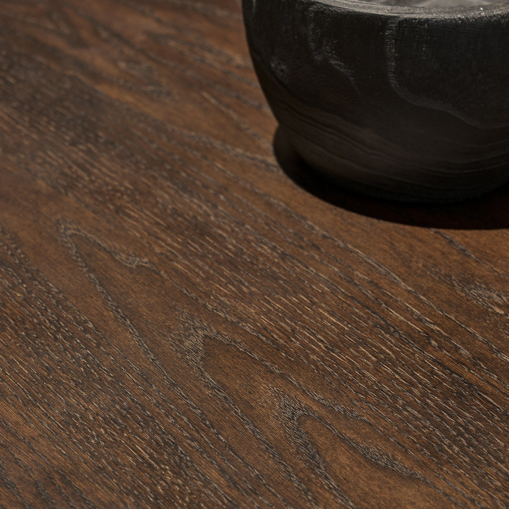 Close-up macro detail of thick red oak wood veneer surface showcasing rich cathedral grain and distressed finish