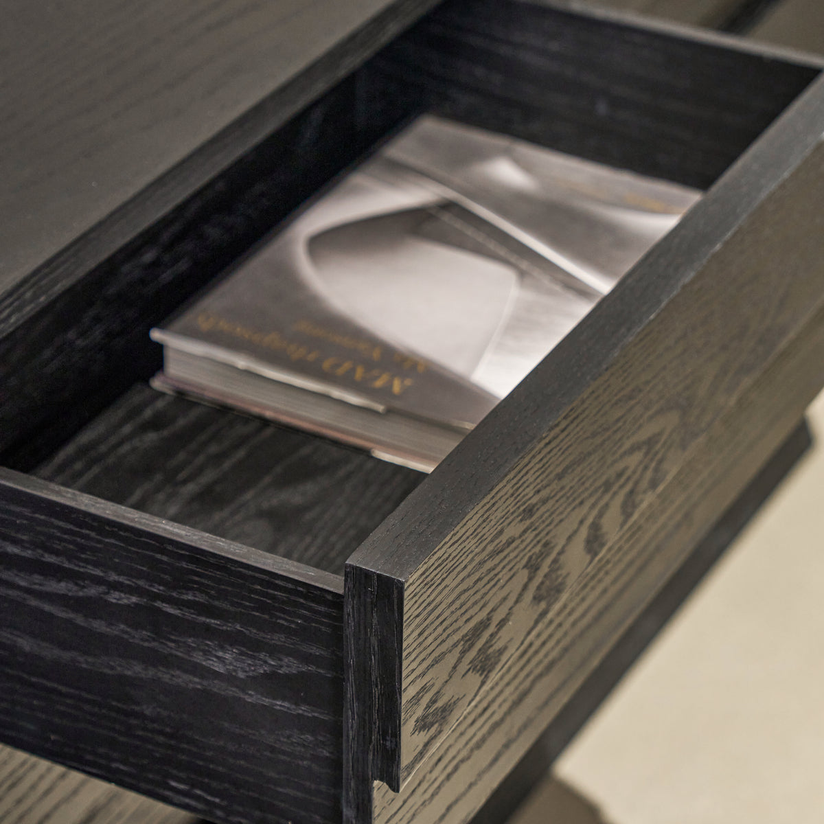 Side perspective of extended drawer box highlighting solid construction, clean edge banding, and deep storage