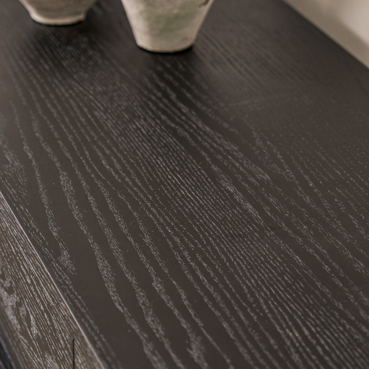 Top surface material detail showing expressive open-pore wood grain on black red oak veneer credenza