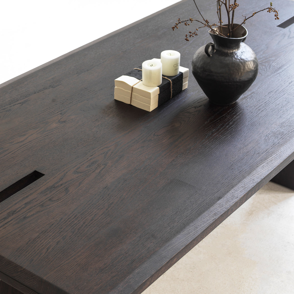 Solid red oak distressed dining table styled with chairs in a contemporary open-concept dining room