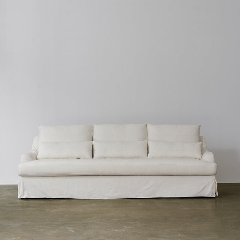 1057 Relaxed Skirted Sofa with Sloping Arms — Ivory
