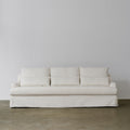 1057 Relaxed Skirted Sofa with Sloping Arms — Ivory