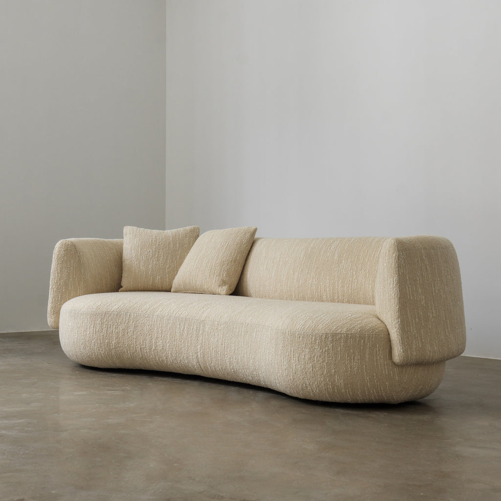 Palo curved cream sofa three-quarter view