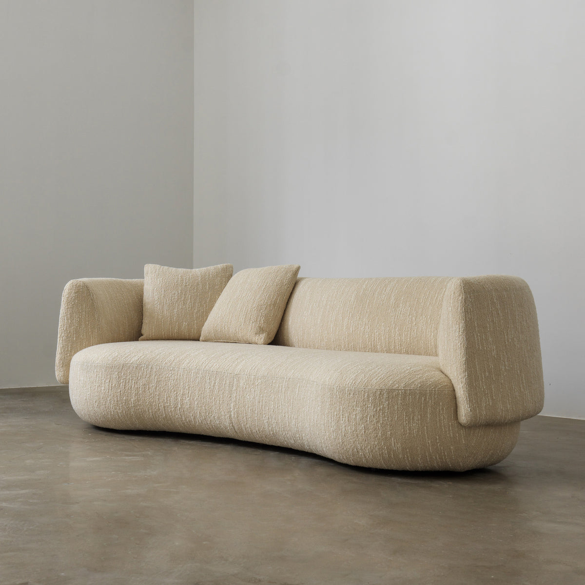 Palo curved cream sofa three-quarter view