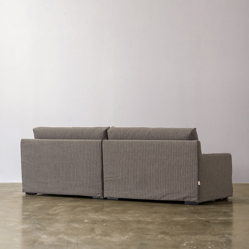Warm gray linen sofa rear view